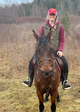 Haley Ceresoli, Sales Representative for Integrity Awnings, riding a horse