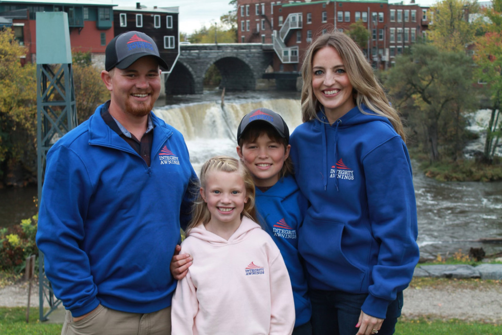 Adam Paquette, Vice President of Integrity Awnings located in Vergennes, Vermont, pictured with his wife and 2 children